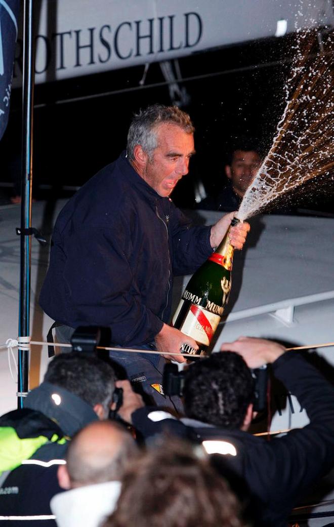 Loick Peyron celebrating with champagne after winning the IMOCA60 class in The Transat 2008 onboard Gitana Eighty - Transat 2016 © onEdition http://www.onEdition.com